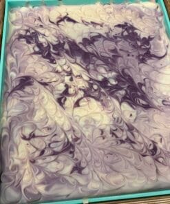 Slab of Lilac City Soap, purple and white swirled soap.